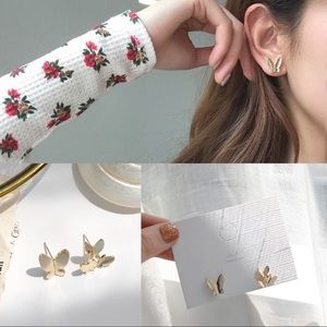 asymmetrical gold butterfly earrings